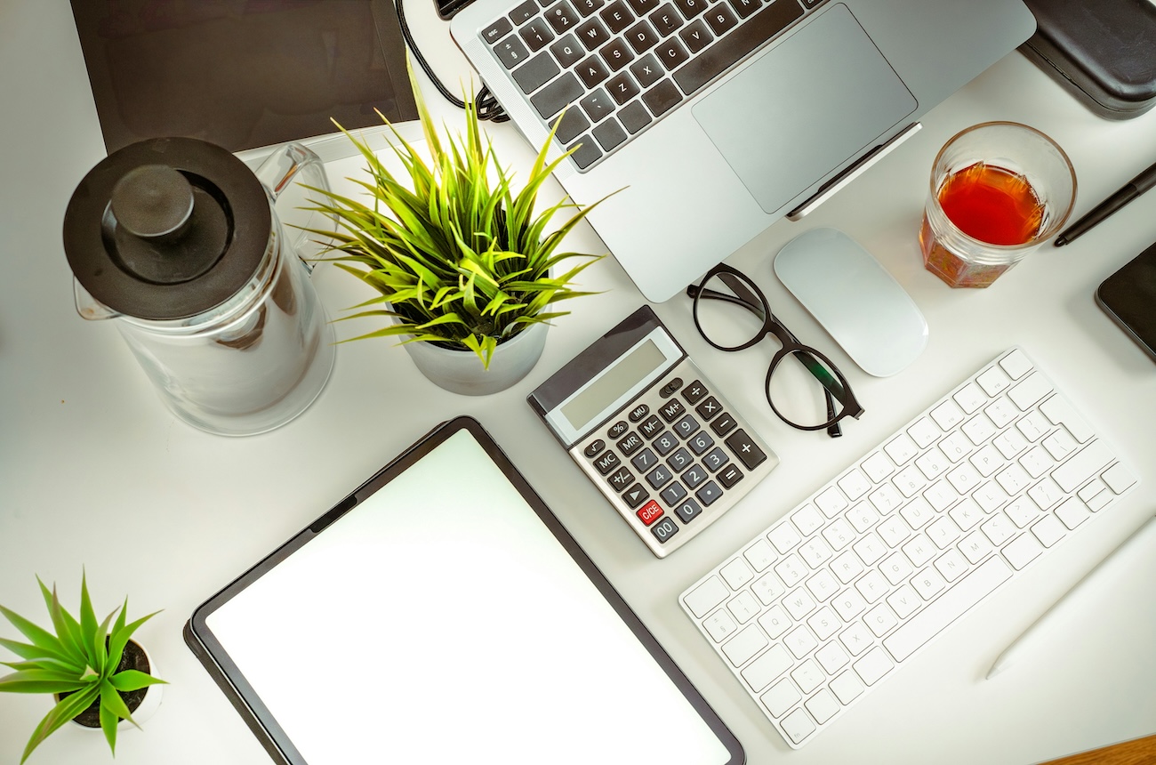 Home office with calculator in the middle.