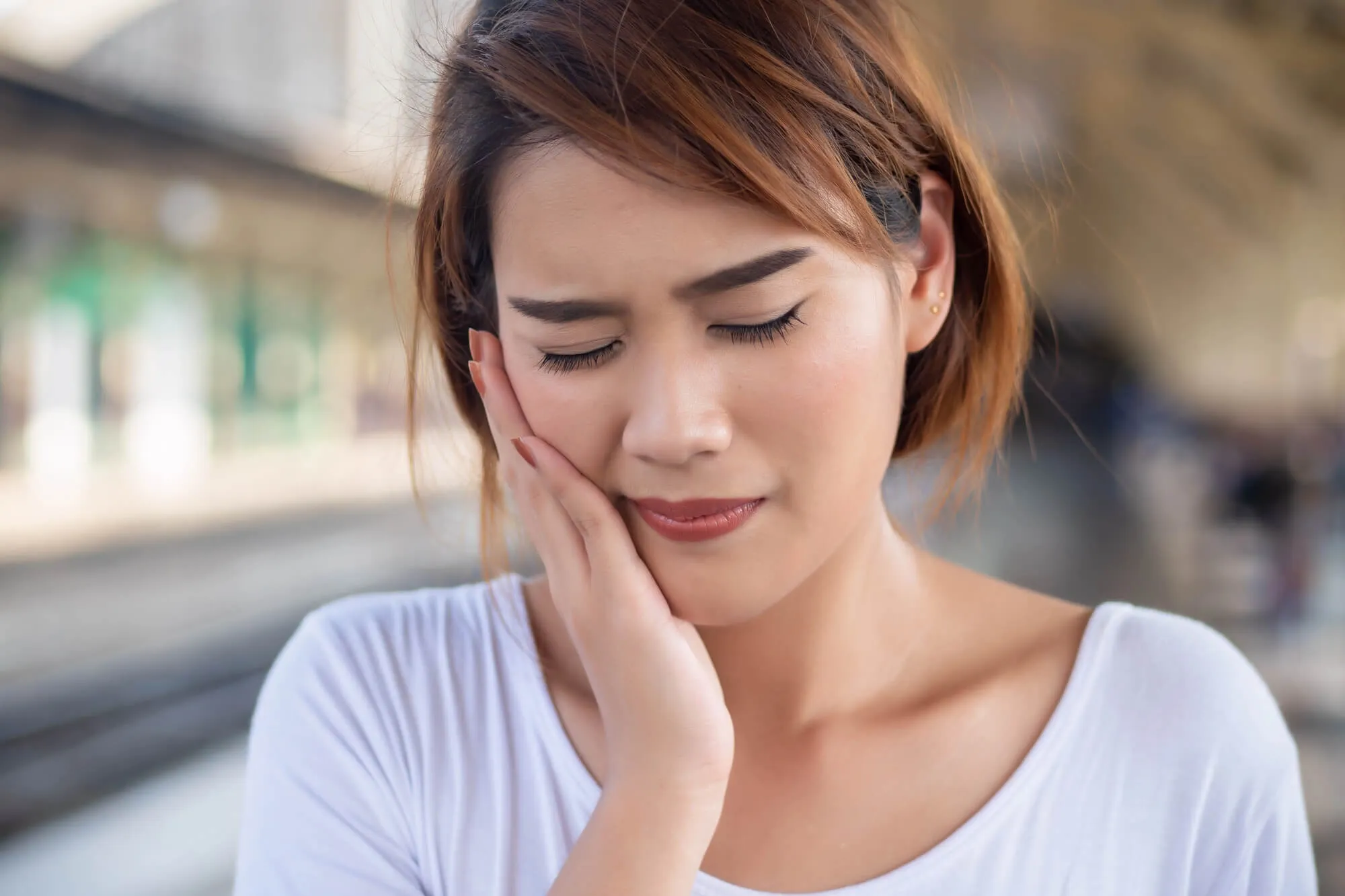 woman with sensitive teeth needs to see a General Dentist Issaquah