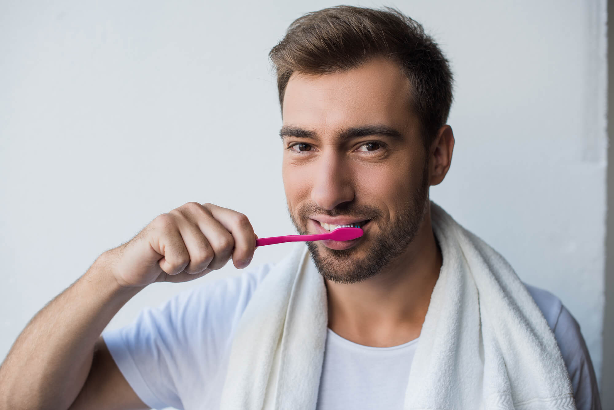 Man brushing his teeth affordable dentists Issaquah