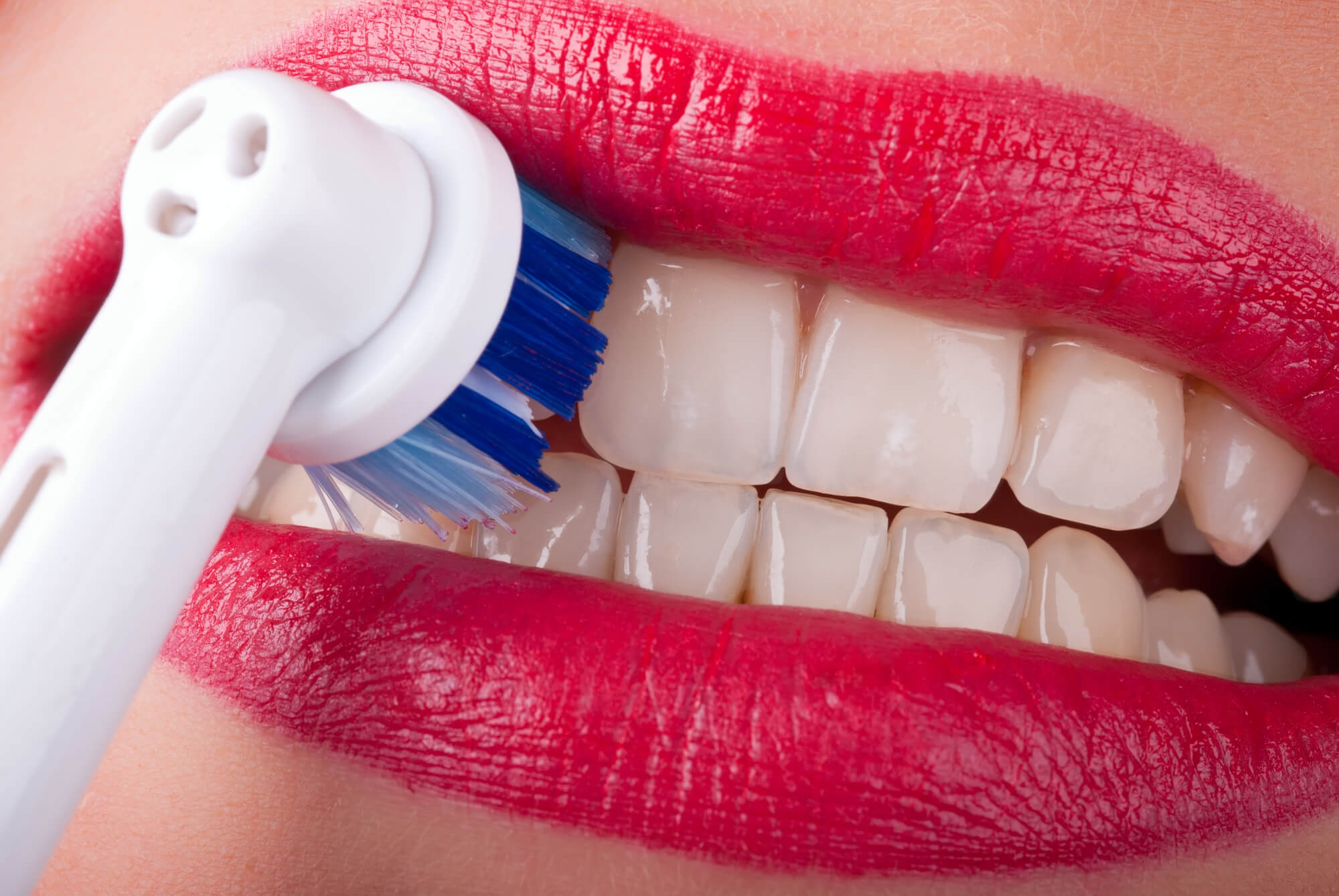 Closeup of a person brushing their teeth gum disease treatment Issaquah