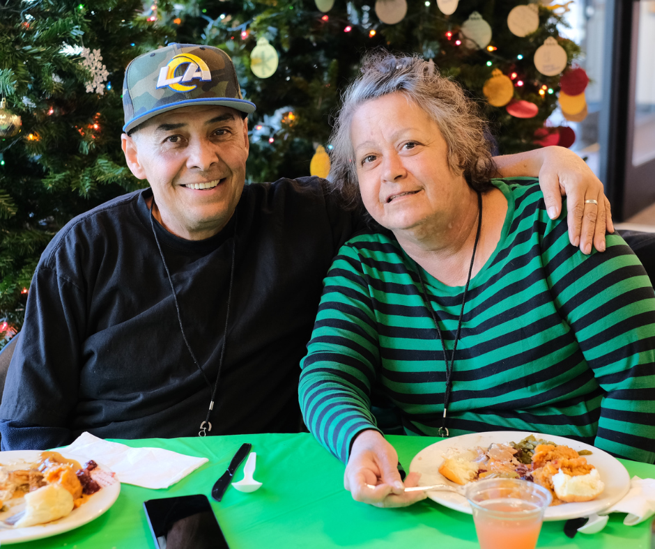 Guests at Springs Rescue Mission sharing a meal together