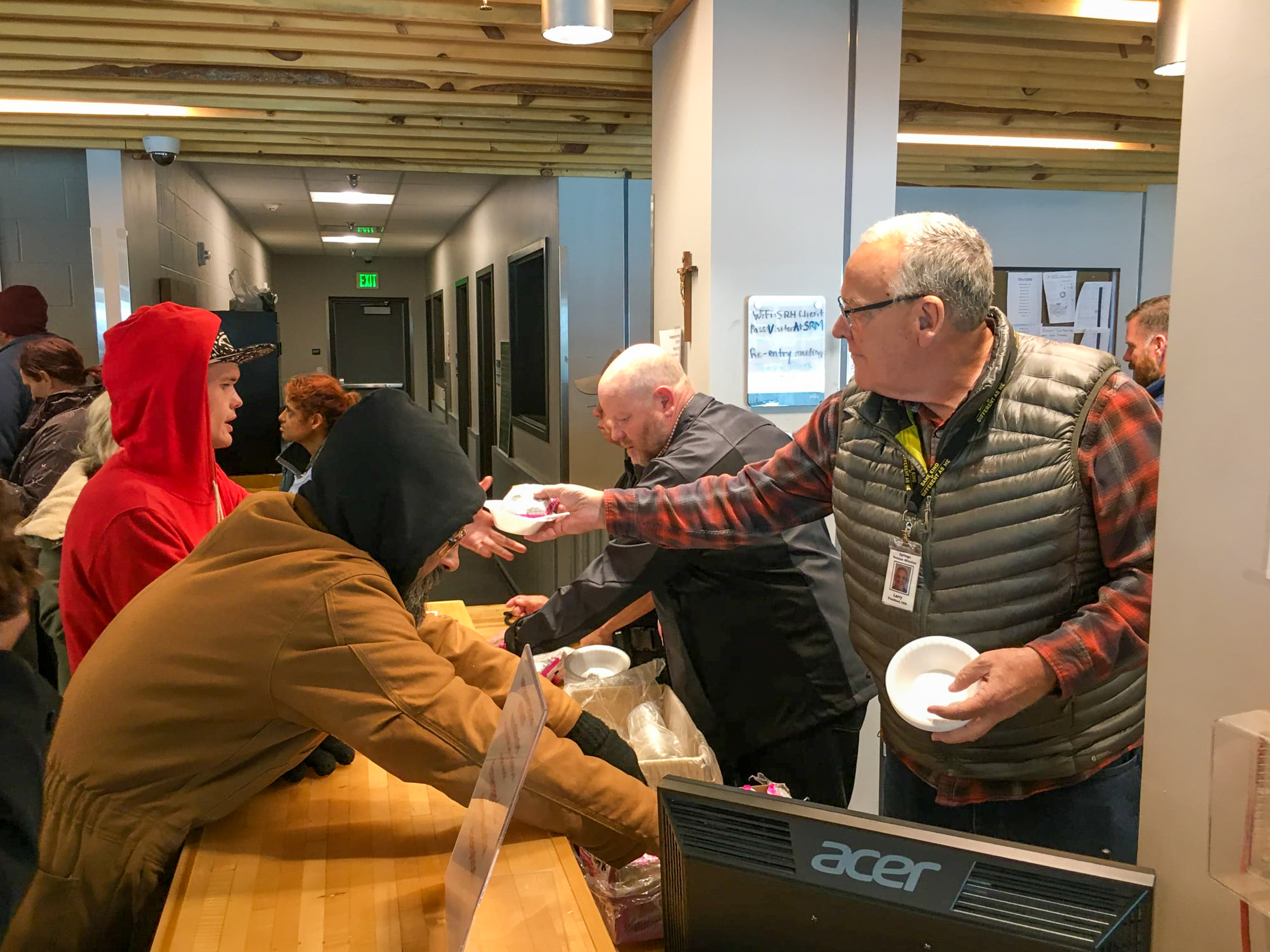 Former Springs Rescue Mission President & CEO Larry Yonker feeds homeless guests on a cold winter day in 2019.