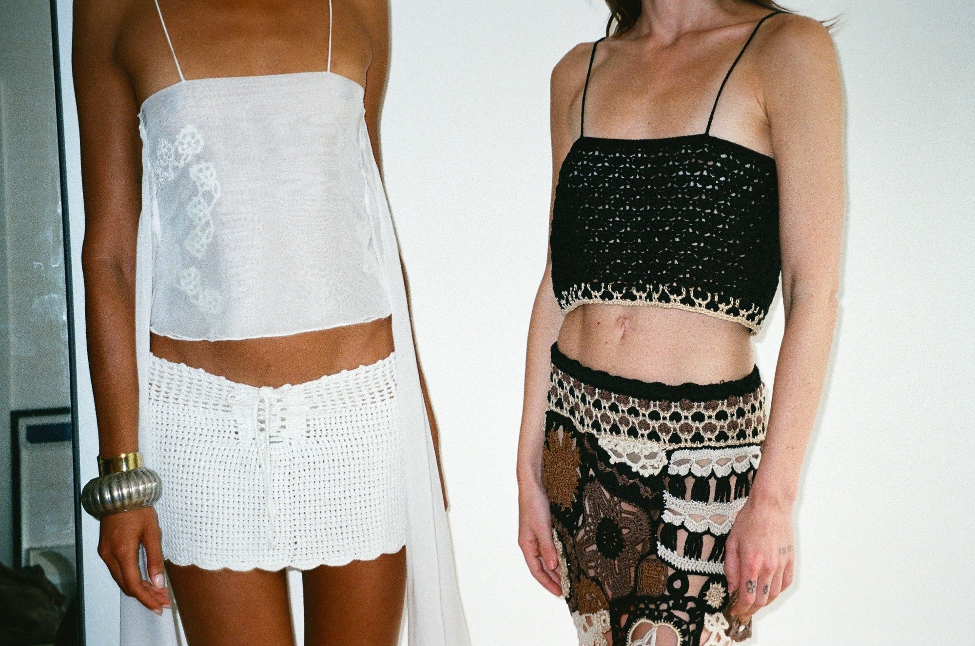 Izu set being worn on model by rocks on the left image. Meja top and Ary skirt being worn by model with a watermelon prop