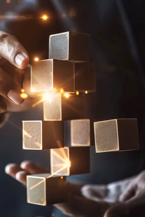 A man in a suit holding a block of gold