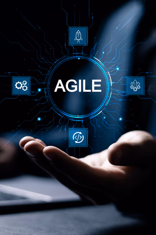 A person holding a laptop with the word agile on it