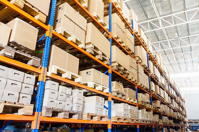 Stacked boxes on shelves in a storage facility