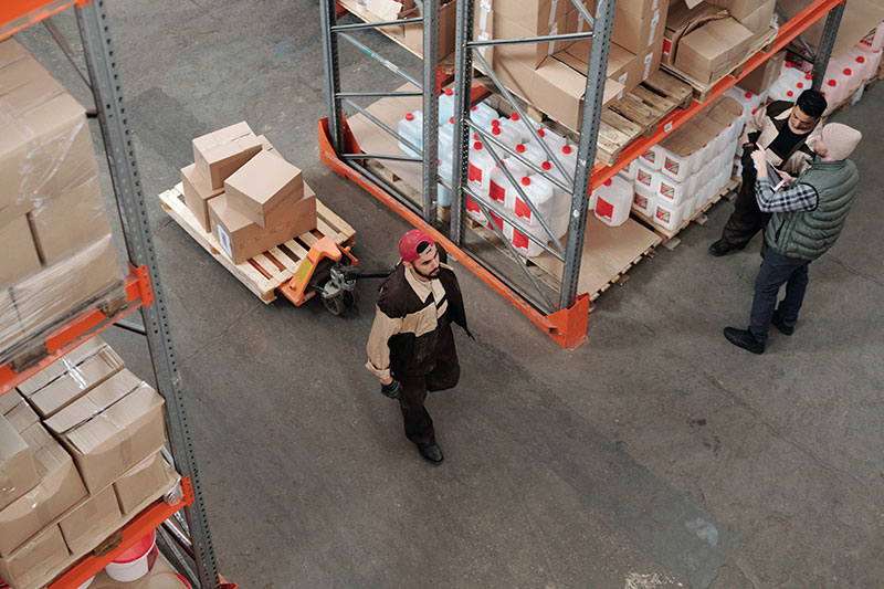 Top view of factory workers in a storage facility