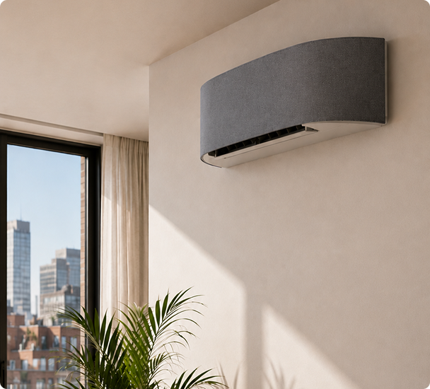 Slim white air conditioning wall unit fitted in a Manchester apartment with floor-to-ceiling windows