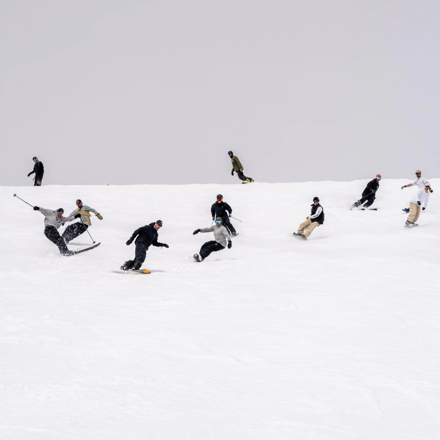 A bunch of people snowboarding and skiing LAAX