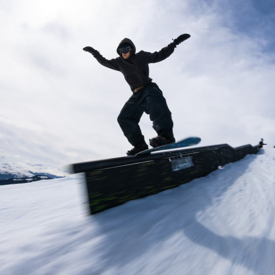 Snowboarder on a rail in LAAX