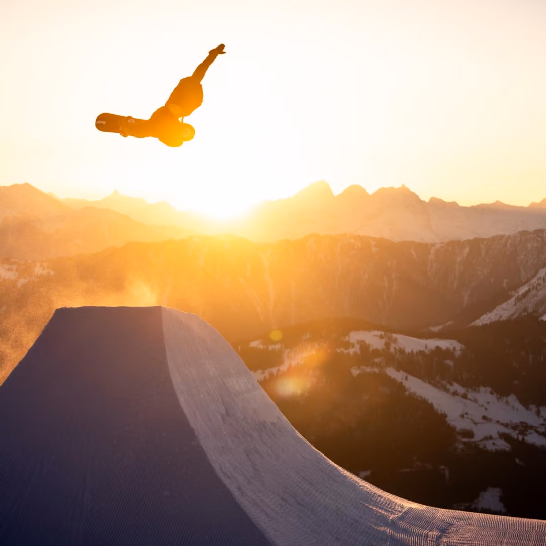 Snowboarder in LAAX with sunset