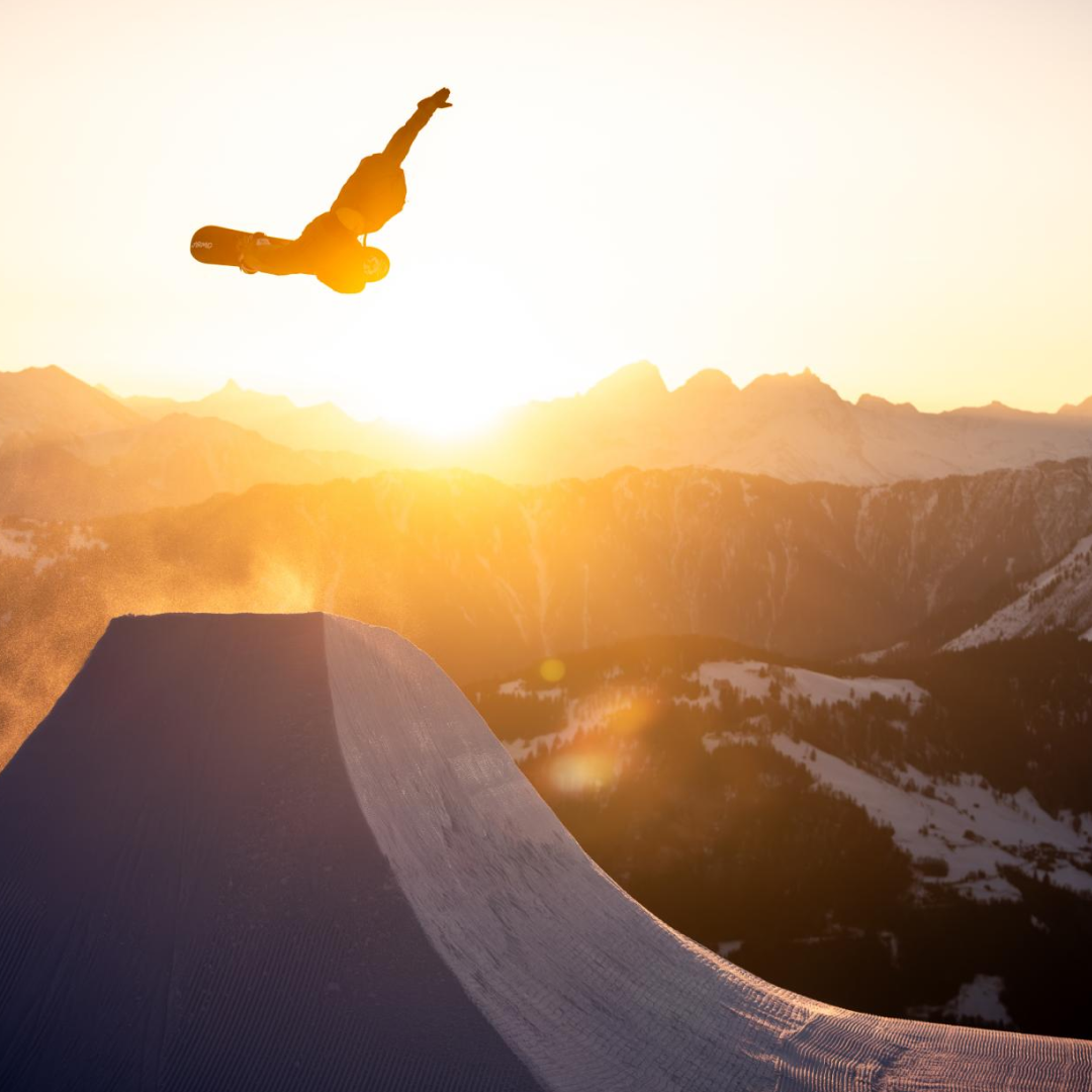 Snowboarder in LAAX with sunset
