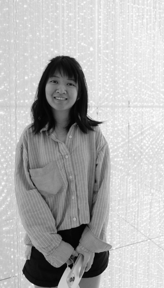 A small short girl smiling for the camera