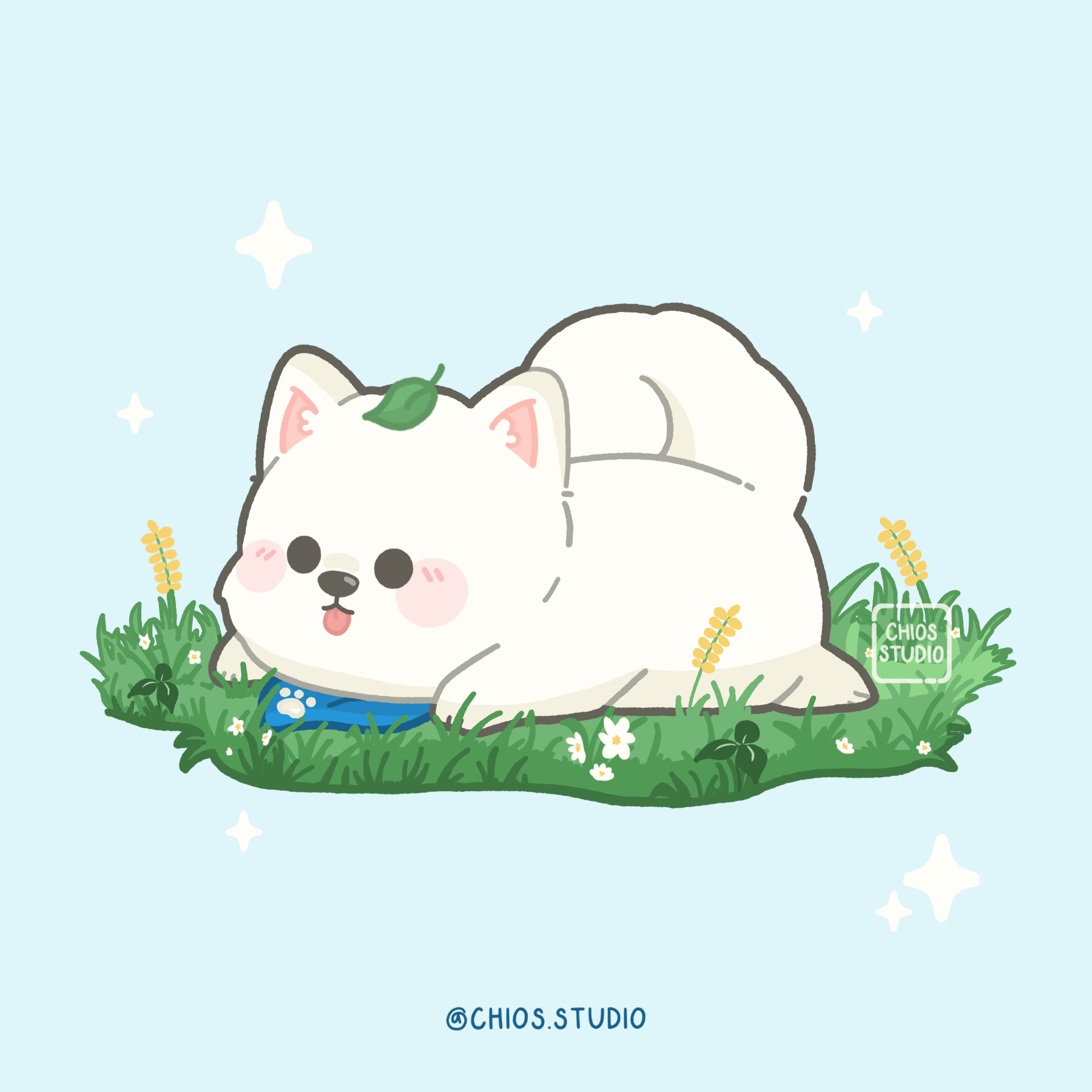 Samoyed laying down and blepping on the grass