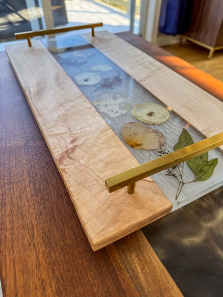A serving tray with wedding flowers cast in resin