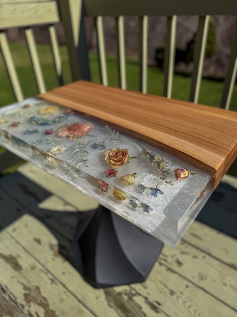 End table with dried wedding flowers cast in epoxy resin