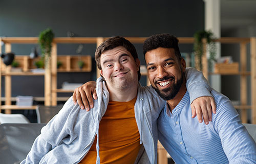 2 people with arms around each other shoulders