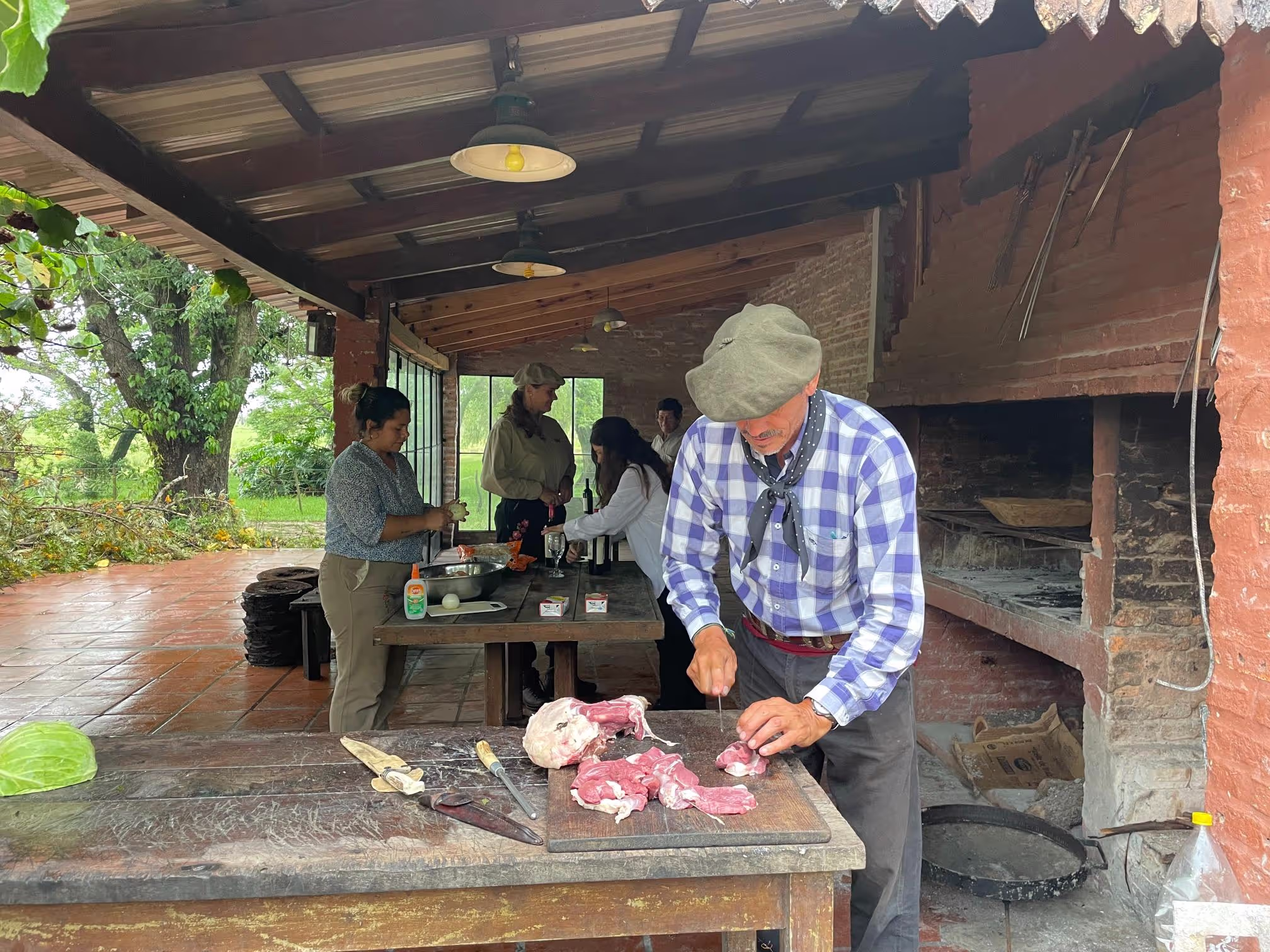 Gaucho preparing meat for an asado