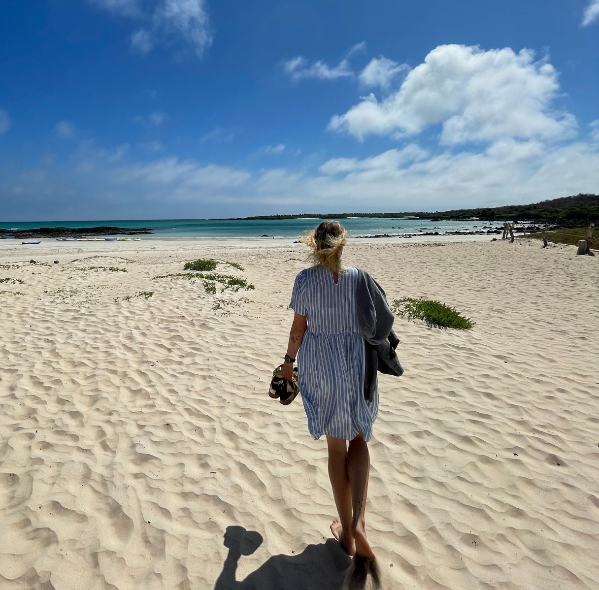 Backpacker on the beach on the Galapagos islands