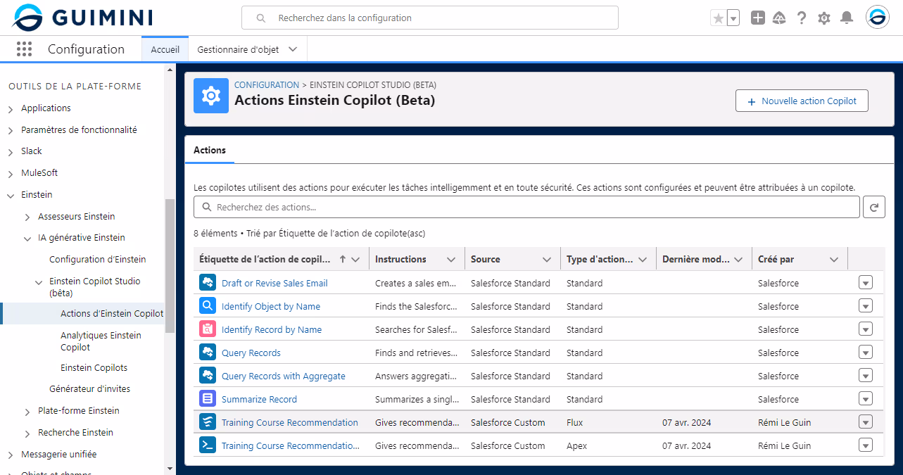  Capture d'écran de la page "Actions Einstein Copilot (Beta)" dans la configuration de la plateforme GUIMINI. La navigation latérale gauche montre plusieurs options sous l'onglet 'Einstein', incluant 'Assesseurs Einstein' et 'IA générative Einstein'. La section principale liste diverses actions de copilote telles que "Draft or Revise Sales Email", "Identify Object by Name", et "Training Course Recommendation", avec des détails sur les instructions, la source, le type d'action, la dernière modification, et le créateur de l'action.