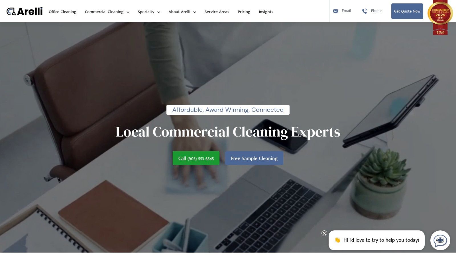 A clean and organized office space with a vacuum cleaner on the carpeted floor, demonstrating a professional office cleaning service.