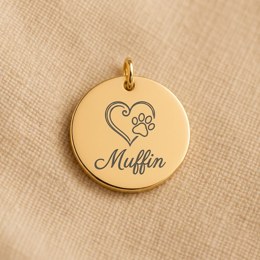 Coin engraved with a paw in a heart and a pet name
