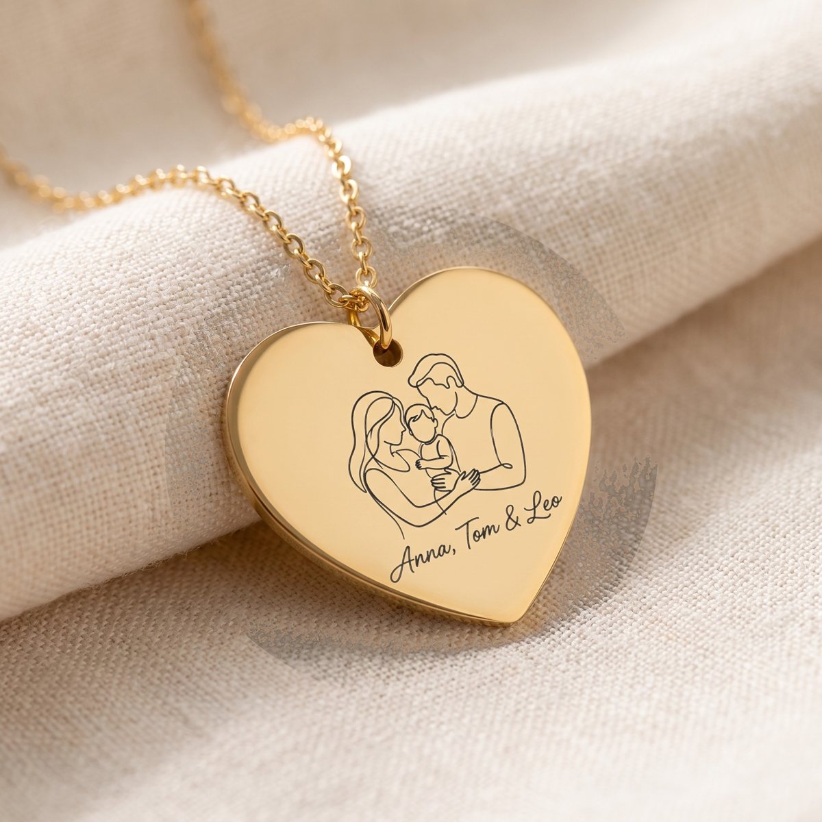 Gold heart necklace engraved with a one-line family portrait and the names Anna, Tom and Leo