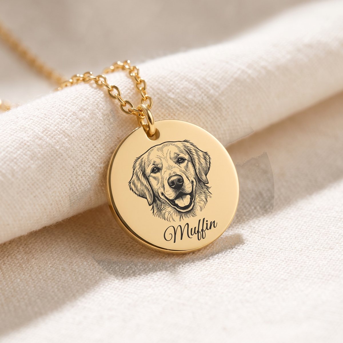 Gold coin necklace engraved with a line-art portrait of a golden retriever and the name Muffin