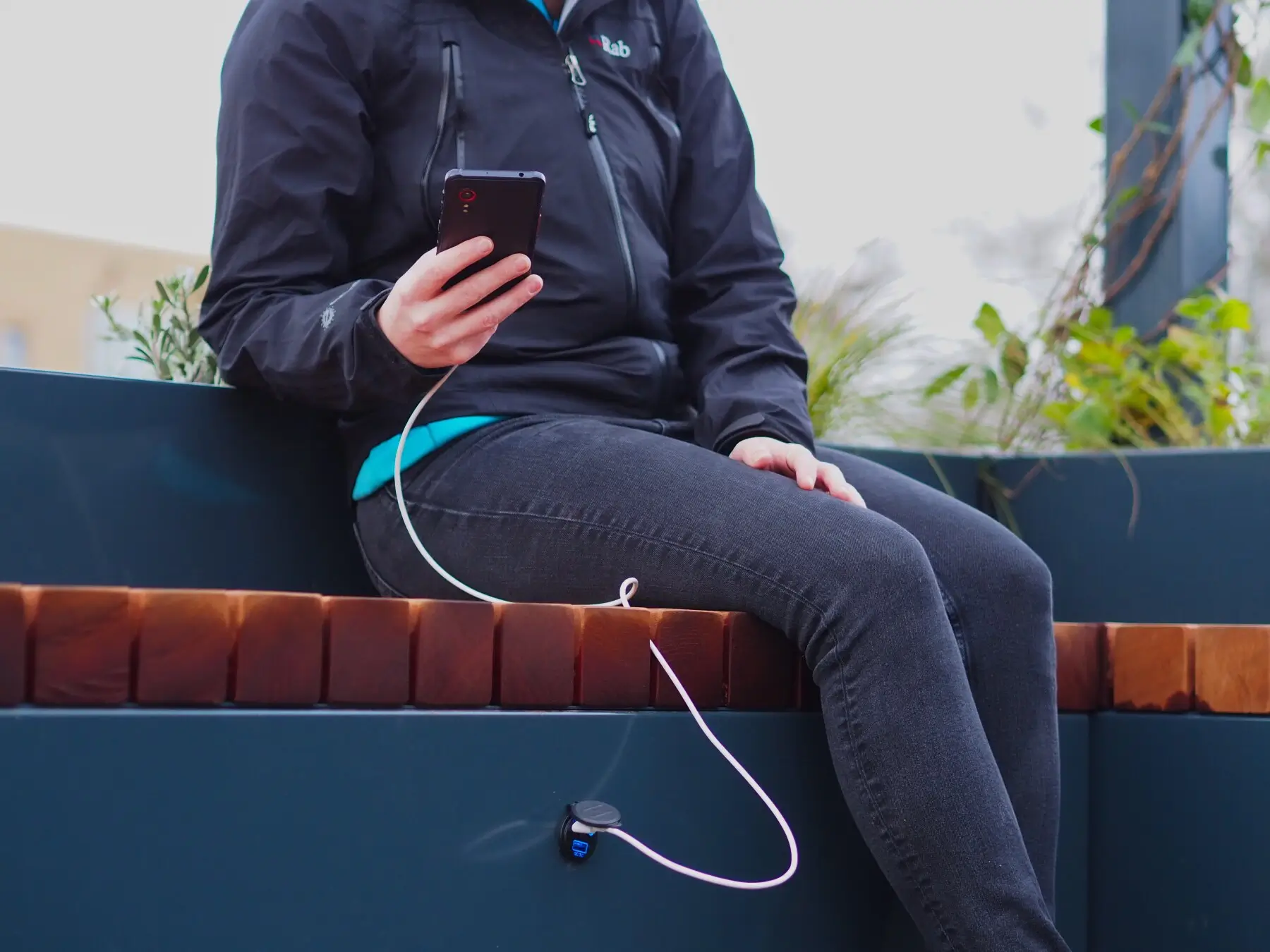 Charging port used for a mobile phone at a mobility hub