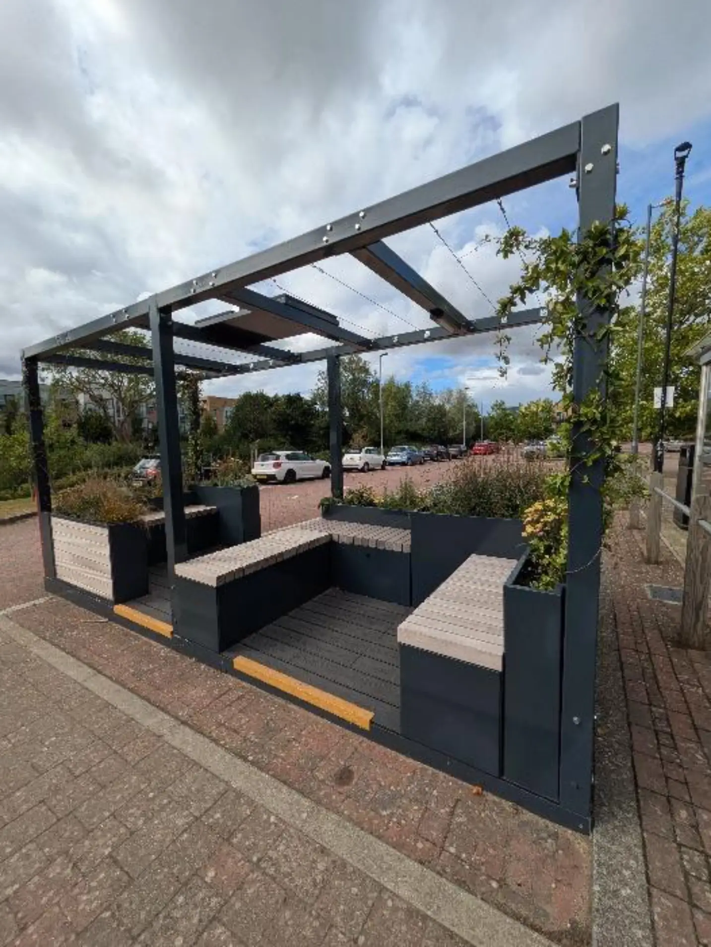 Lyde Green Park & Ride mobility hub seated area with planters