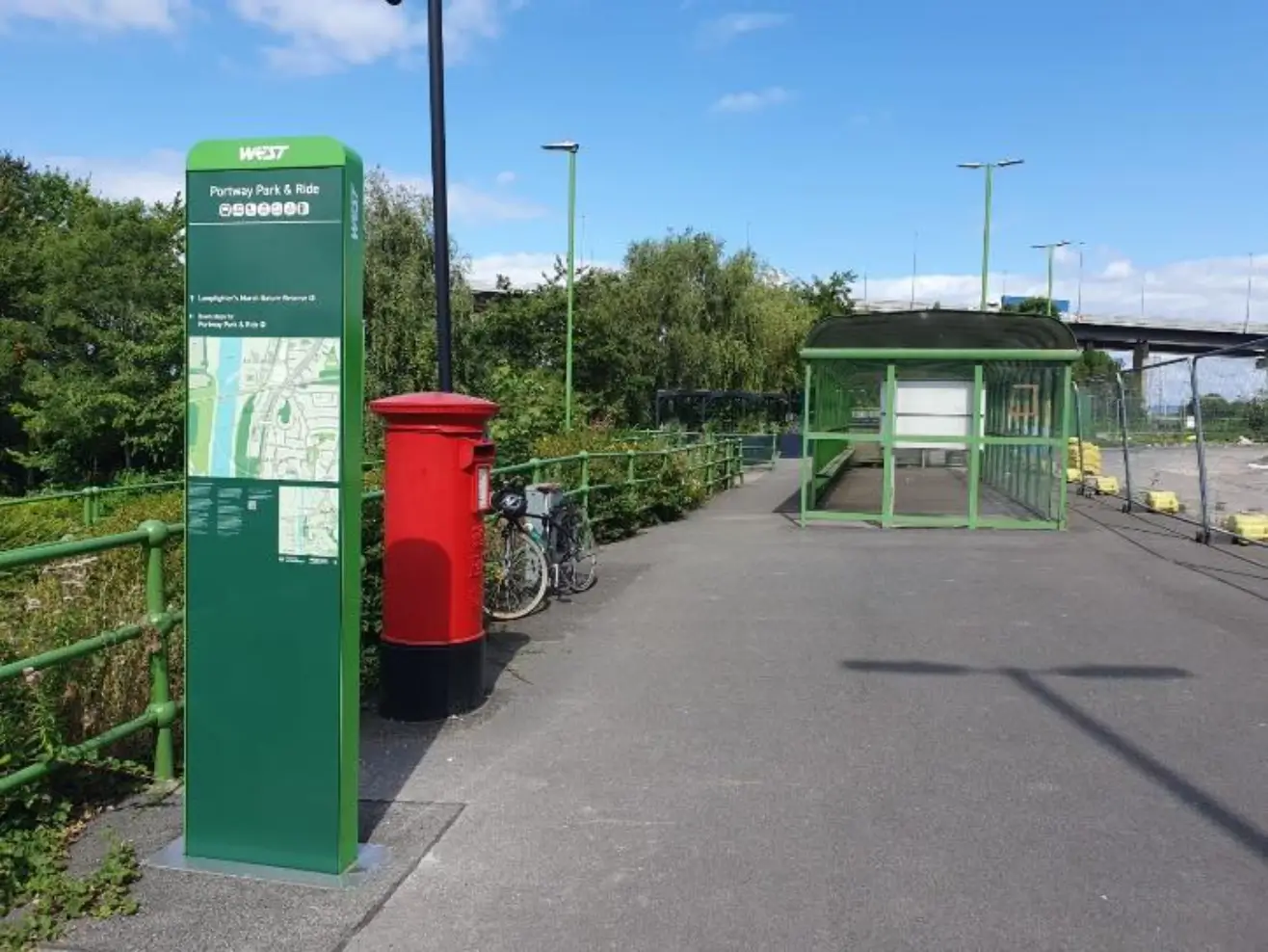 Mobility hub totem, red post box and bus stop