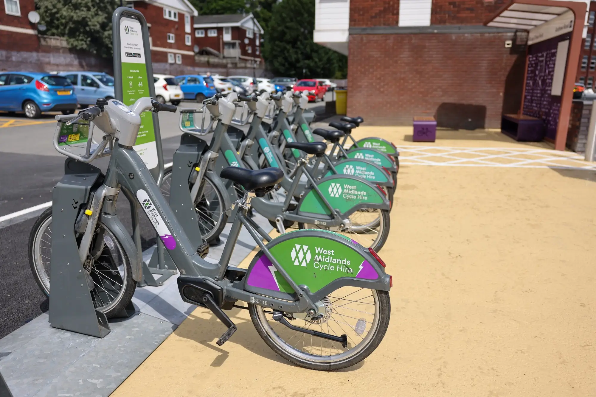 Shared bikes parked in a docking station at the TfWM Andrew Road mobility hub