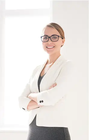 Smiling female scientist or doctor in a lab coat using a digital tablet in a research laboratory