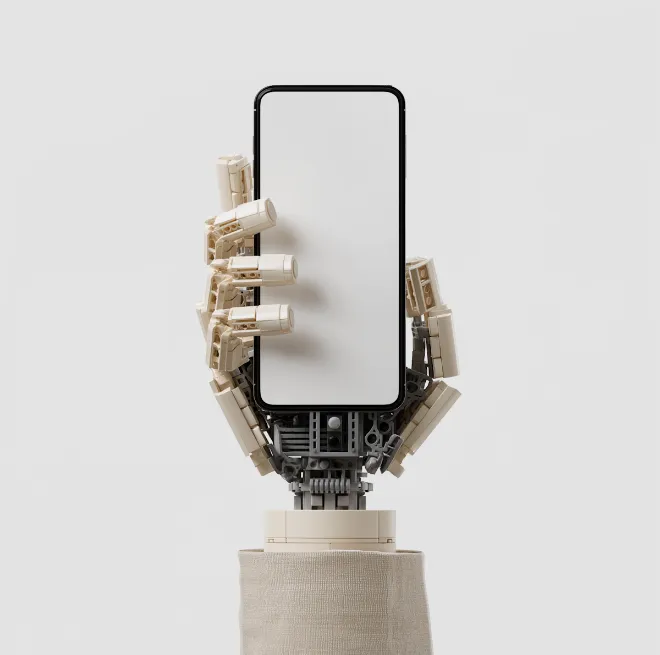 Robot hand holding a smartphone with a blank white screen against a plain background.