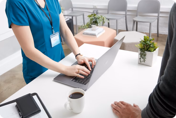 Small business owner typing on a keyboard in a veterinarian's office