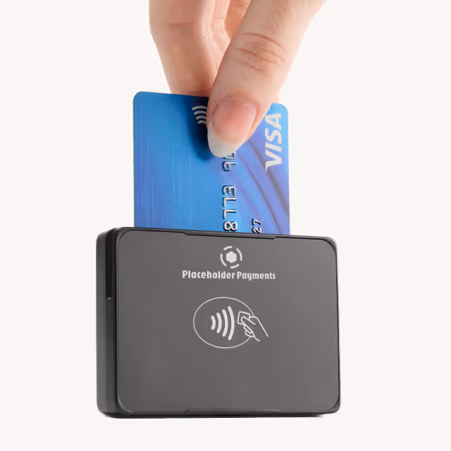 Hand inserting a blue Visa card into a black Placeholder Payments card reader.