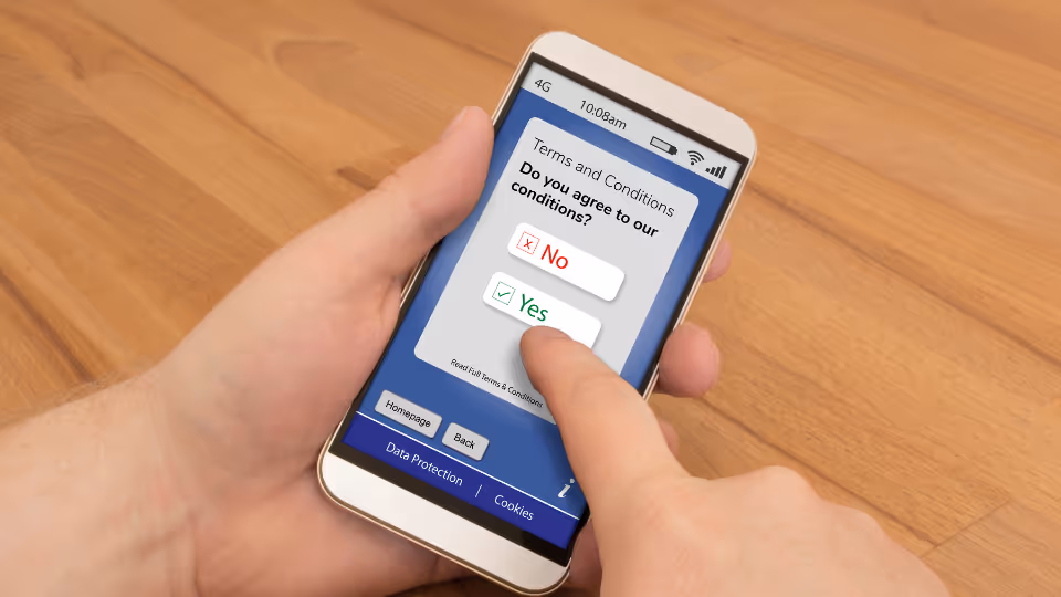 Alt text: A person agreeing to Terms and Conditions on their smartphone