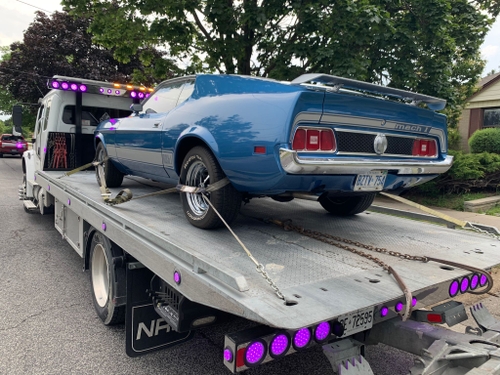 bilal towing flat bed towing a muscle car