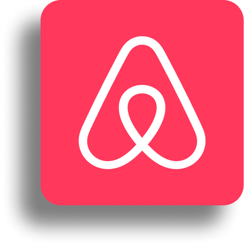 White Airbnb logo on a rounded red square background with a shadow effect.