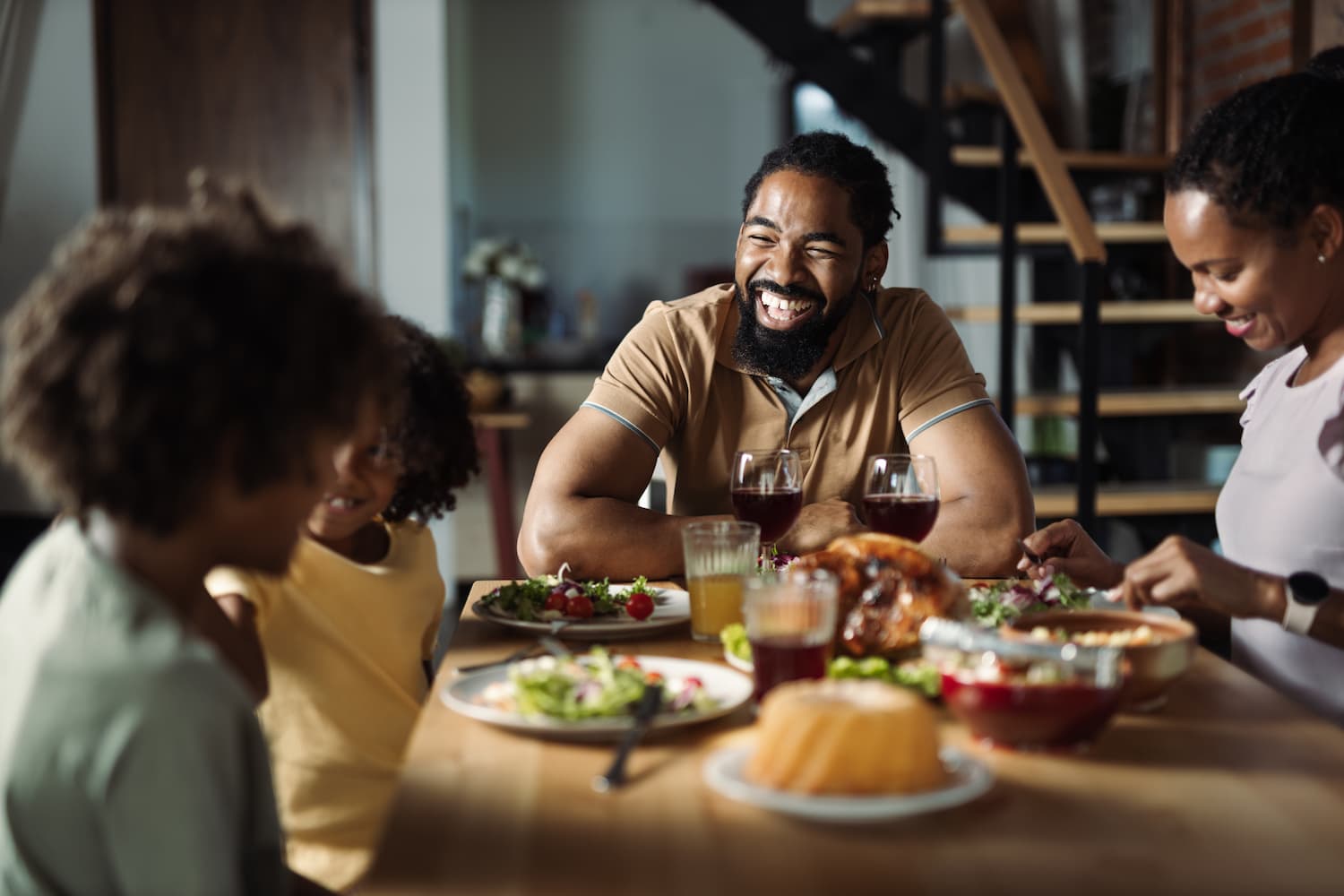 Family sharing dinner at home