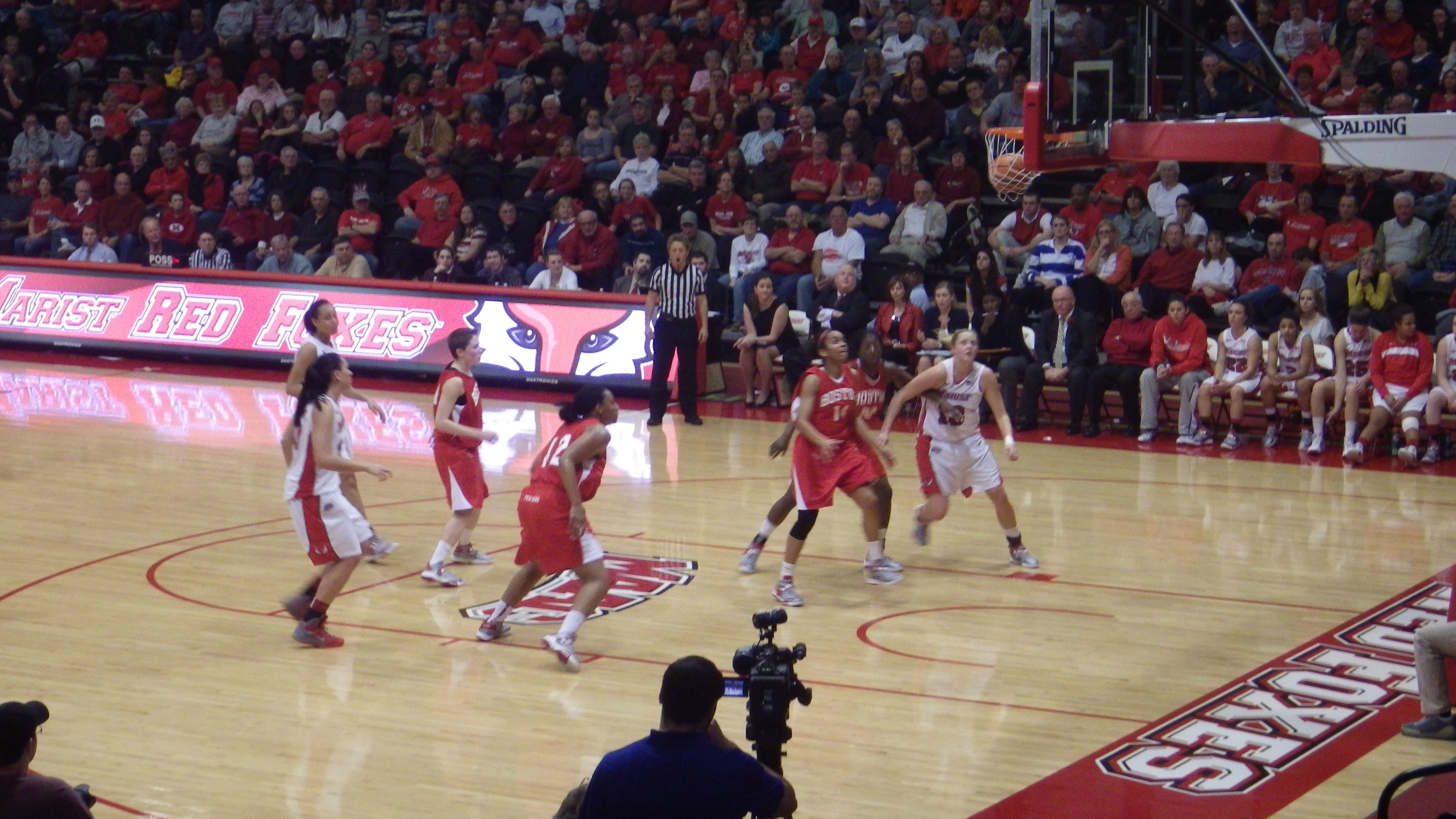 College athletes competing in a basketball game, representing athlete influencer campaigns and NIL deal execution.