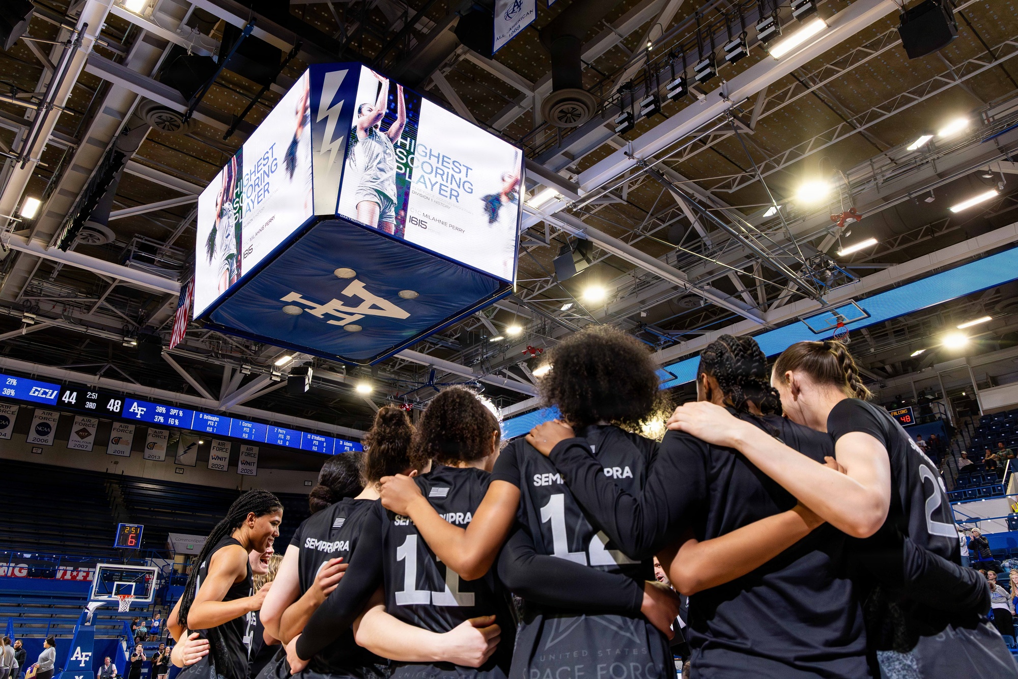 Female college basketball athlete recognized during a game, representing female athlete influencer partnerships and Gen Z brand trust.