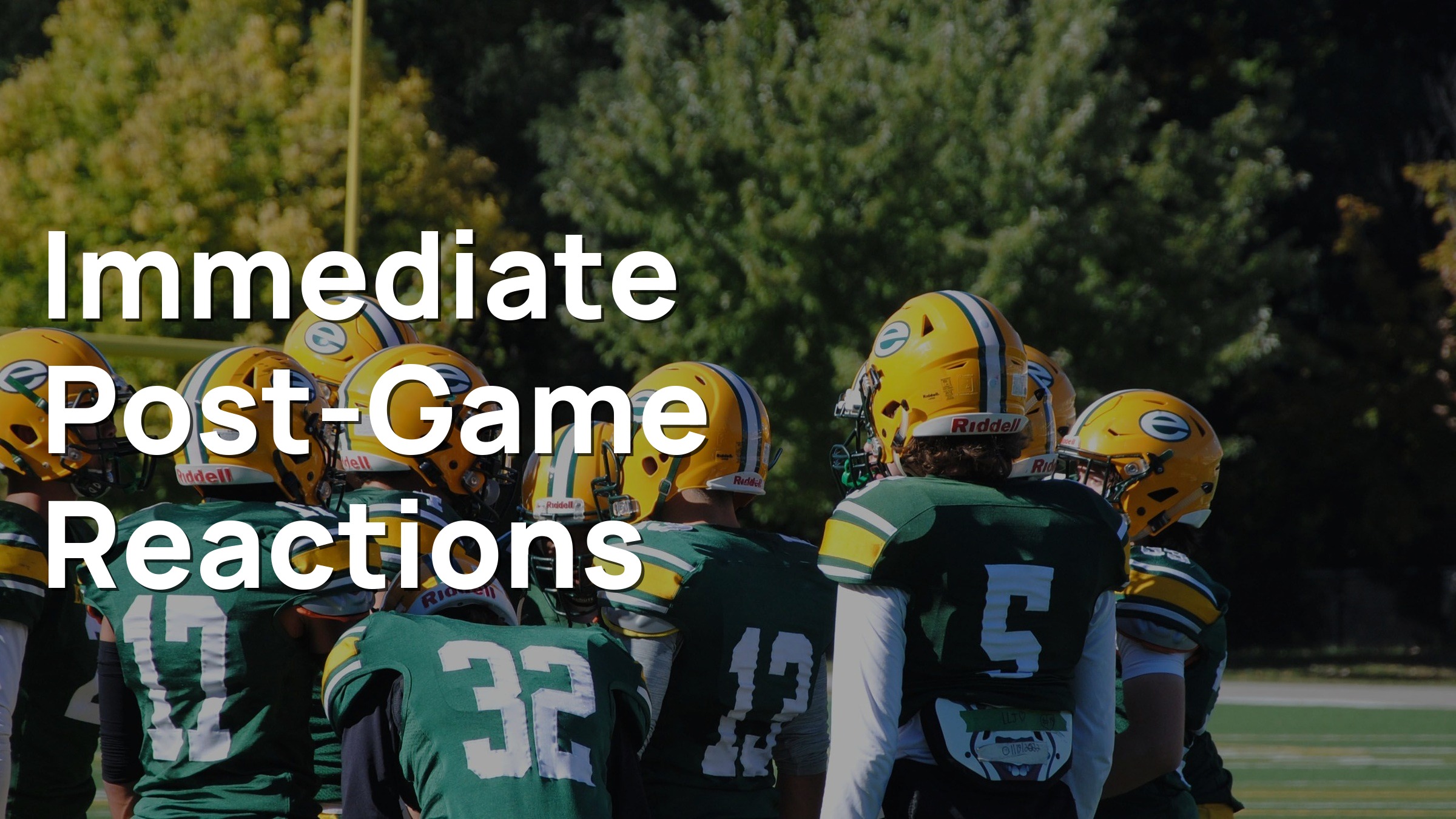 Amateur American football players in helmets and pads huddling on a turf field with a yellow goalpost after play