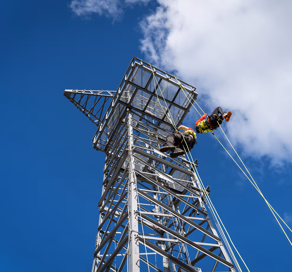 Two rope access roofers checking the building construction
