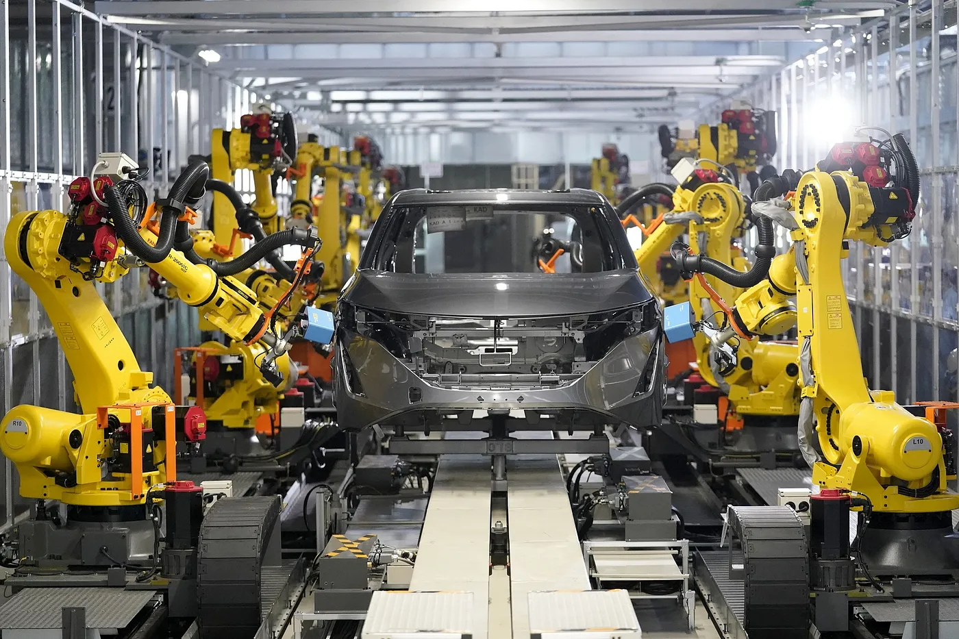 Robotic arms on an automobile manufacturing line. Source: Nissan Motor Corporation