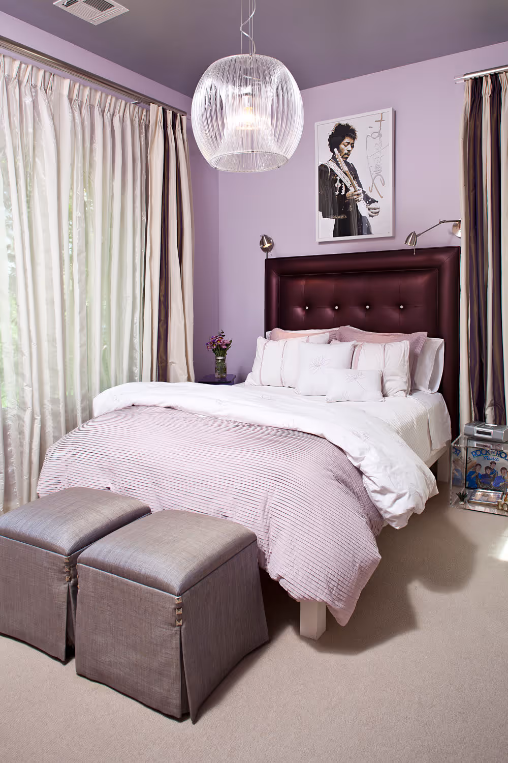Mauve girls bedroom with purple headboard and Prince poster.
