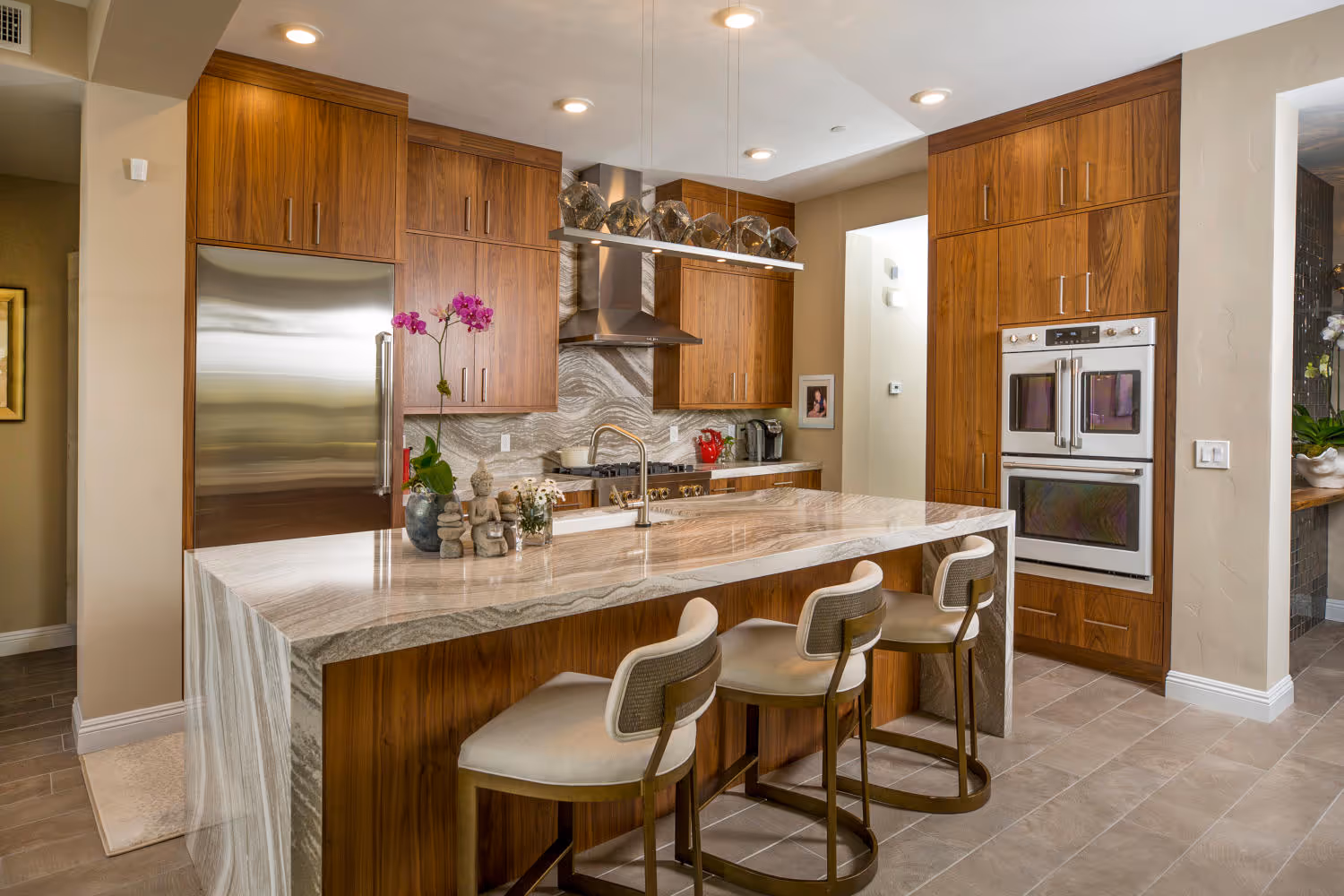 New kitchen with oak modern cabinets and stone countertops.