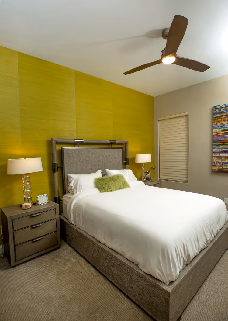Guest bedroom with grass cloth wallpaper.