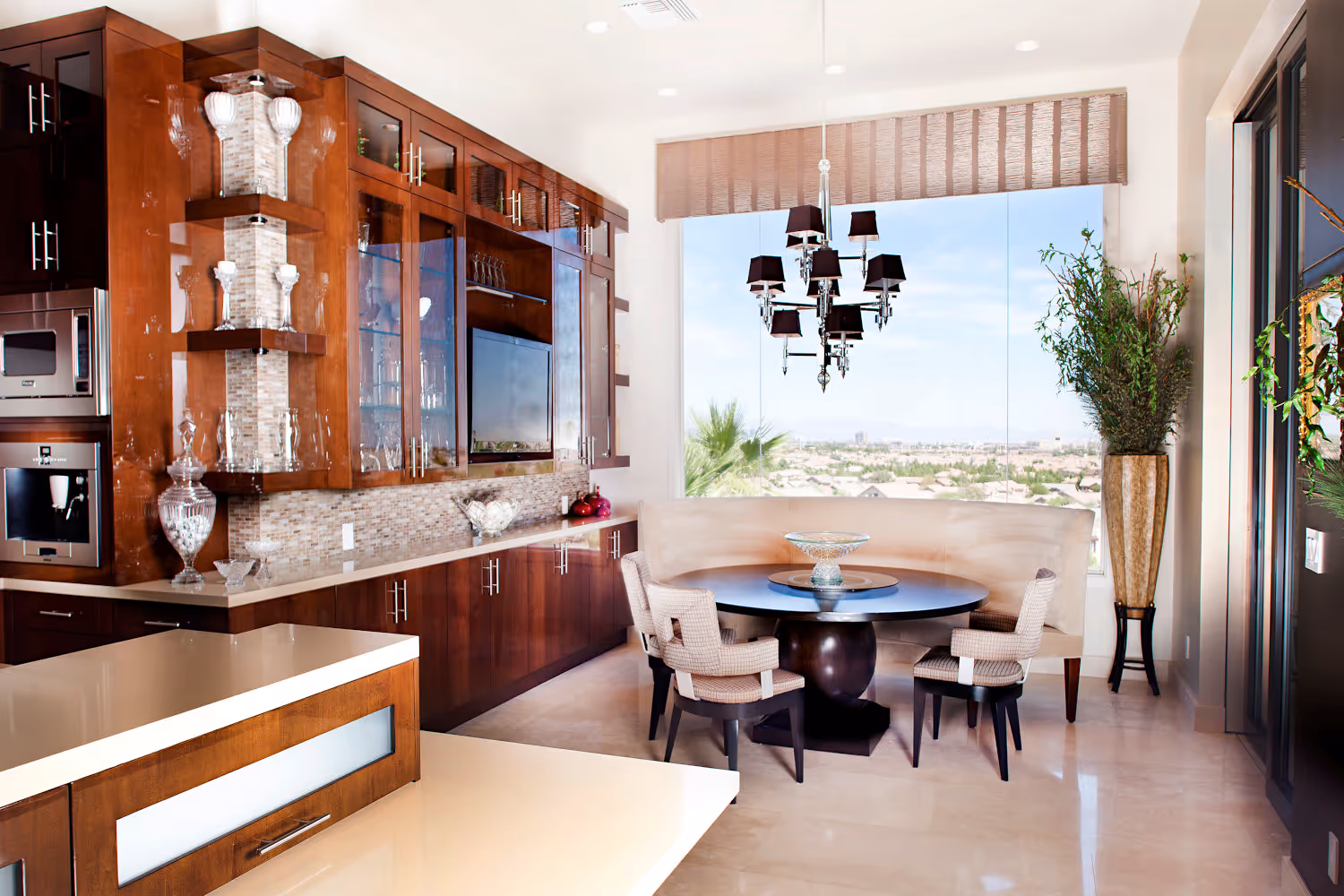 Contemporary Kitchen with lacqured brown cabinets, beige quartz countertops travertine 