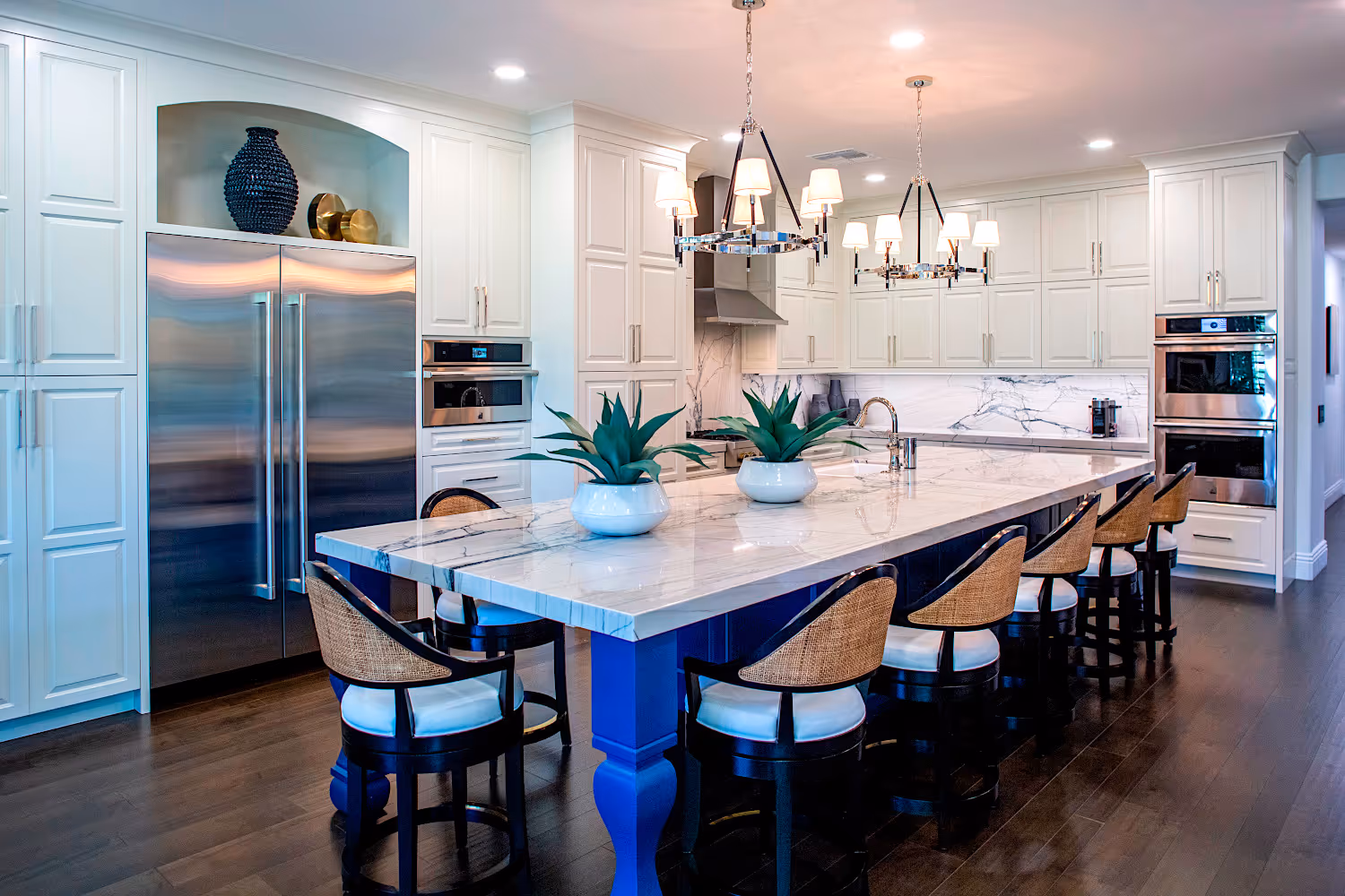 Open floor plan Kitchen with white cabinets and quartzite countertops.